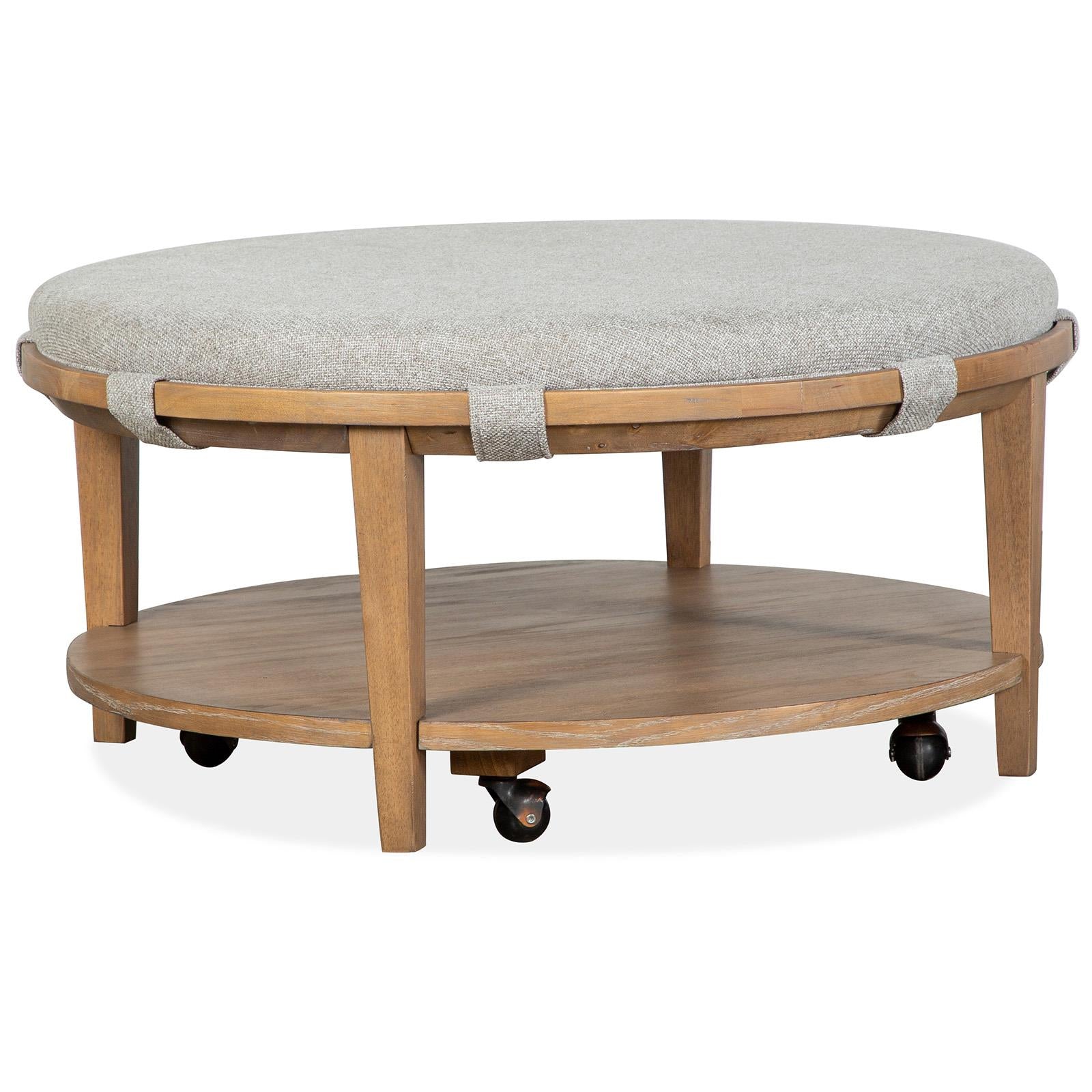  Magnussen Lindon T5570-45G Round Cocktail Table with Grey Upholstered Top Casters IMAGE 1